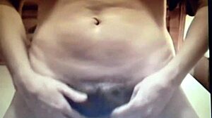 Brunette amateur masturbating on bed with nipples and clit