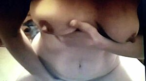 Brunette amateur masturbating on bed with nipples and clit