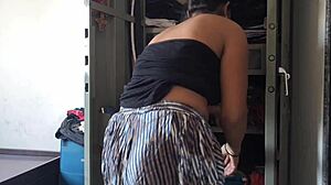 desi maid cleans cupboard with owner