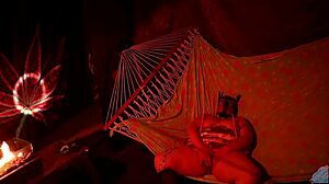 getting frisky in a tent fingering her wet hole in a hammock