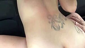 Busty hooker rides bareback in car midday