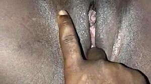 Watch this African maid's tight pussy getting fingered hard.