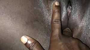 Watch this African maid's tight pussy getting fingered hard.