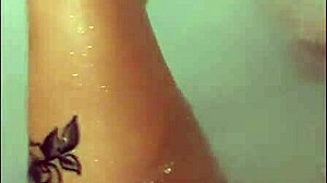 a pretty wife with long hair masturbates in jacuzzi bath, ending with bright cumshot