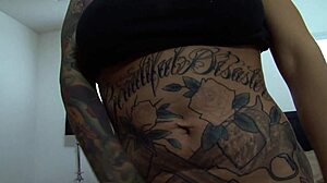 Tatted Brunette Enjoys Smooth Pussy Adventure