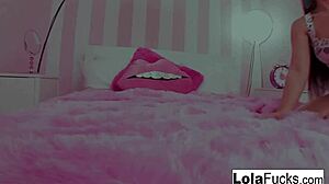 Lola, that sexy teen, plays with her tight pussy in the bedroom