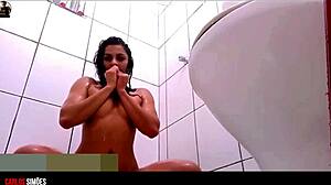 latina amateur shows tattooed body in shower