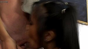 two brunettes moan while blowing one cock together