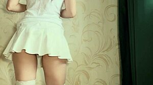 Naughty girl in stockings and lingerie rides see-through dildo passionately