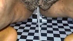 Dirty slutty maid in thong and lingerie peeing indoors with her hairy pussy exposed