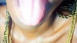 African teen shows her phat lips and drinks cum with joy