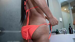 Sindy models orange swimsuit then gets assfucked in kinky photoshoot