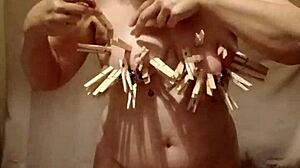 Homemade milf slave bends over in public for self-session with clamps and belt!