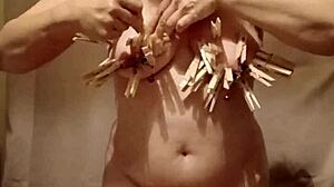 Homemade milf slave bends over in public for self-session with clamps and belt!