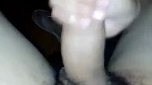 Wife gives handjob watching porn