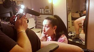 Behind the scenes, stunning brunette teen Black Lynn gives a huge blowjob with handjob and swallows mouthful
