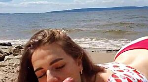 Intense blowjob by brunette couple on river.