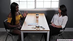 Ebony lesbian licking a busty milf's pussy on TheLesbianFactor.