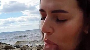 Intense blowjob by brunette couple on river.