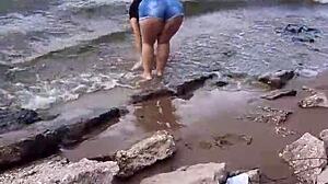 Intense blowjob by brunette couple on river.