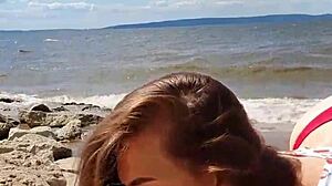 Intense blowjob by brunette couple on river.