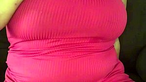 Young girl masturbates on sofa.