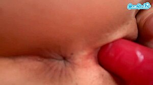 sexy hot brunette cheerleader in stockings masturbates with dildo in locker room, reaching intense orgasm