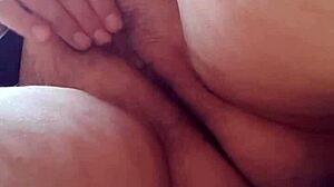 I masturbate my plump unshaven pussy under a short skirt.