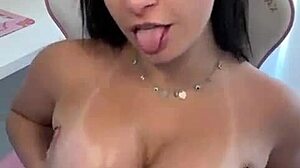 Beautiful Latina Pornstar Emanuelly Raquel Dirty Talks While Applying Oil to Her Big Boobs and Ass