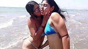 Latina lesbians on beach get clothes ripped, fucked by monster cock, cumming hard.