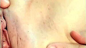 Hot mature woman shows her shaved pussy in a close up homemade video. She fingers her natural tits gently