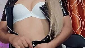 The latex transsexual masturbates passionately.