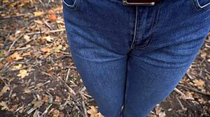 The milf teases her big cameltoe in tight blue jeans outdoors