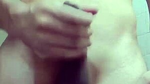 Shy skinny guy strokes his monster cock in the work bathroom