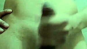 Shy skinny guy strokes his monster cock in the work bathroom