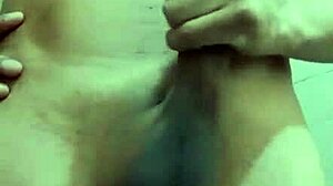 Shy skinny guy strokes his monster cock in the work bathroom