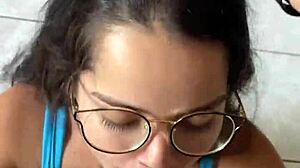 Nerdy brunette girlfriend gives deep blowjob to big cock in shorts, contrasting beauty with passion