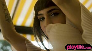 Petite brunette babe reveals juicy tits and bubble butt outdoors