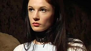 Bent over lesbian slave takes big black strapon deep in pussy.