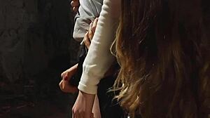 Bent over lesbian slave takes big black strapon deep in pussy.