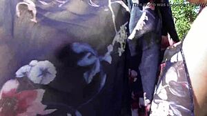 Hairy mature woman flashes her pussy under skirt at public park.