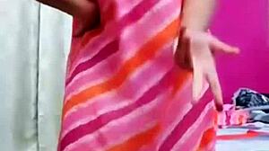 Indian aunty boldly shows boob while dancing hotly.