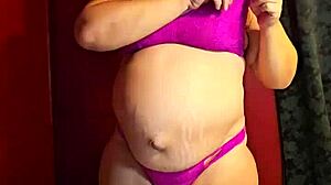 preggo milf slowly strips off her clothes, craving a hard fuck