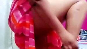 Indian aunty boldly shows boob while dancing hotly.