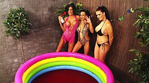 Three amazing lesbian girls in sexy swim wear have an outdoor orgy