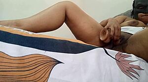 My delicious prostitute fingers her juicy pussy on the bed edge