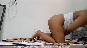 My delicious prostitute fingers her juicy pussy on the bed edge