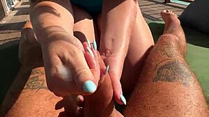 hot bbw milf babe gives fast sloppy handjob to monster cock on balcony over ocean