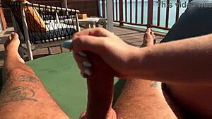 hot bbw milf babe gives fast sloppy handjob to monster cock on balcony over ocean