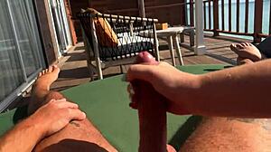 hot bbw milf babe gives fast sloppy handjob to monster cock on balcony over ocean